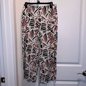 White pants with black and orange pattern by Mi Ami
